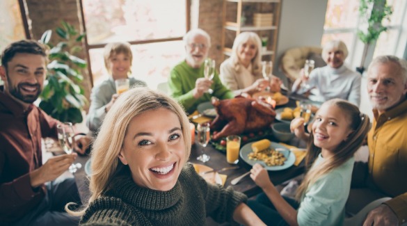 Family Thanksgiving Dinner around the table | Watershed Bryson City Cabins